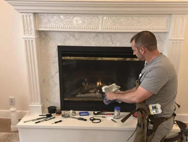 Medina Chimney Sweep performing fireplace maintenance in Medina, OH