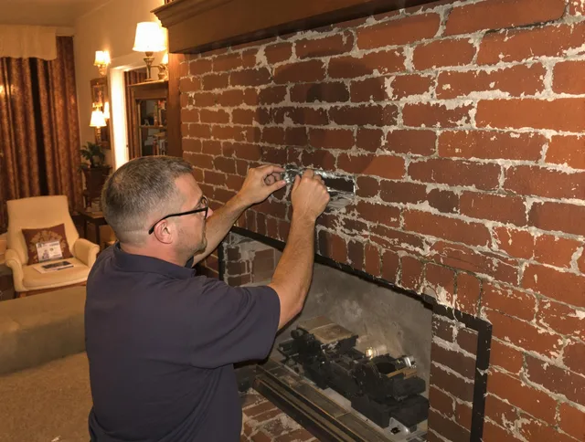 Medina Chimney Sweep expert fixing a fireplace in Medina, OH